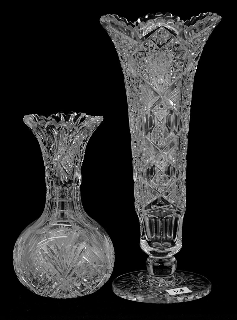 (2) VASES INCLUDING:: (2) VASES INCLUDING: (1) 11 3/4" PEDESTAL PEMBROKE PATTERN BY STEUBEN, EXACTLY AS SHOWN IN GLASS OF FREDERICK CARDER BY GARDNER, PAGE 349 - (1) 7 1/2" WITH HOBSTAR, CROSSCUT DIAMOND AND FAN MOTIF (CLO