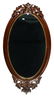 49" X 25" OVAL HANGING WALNUT MIRROR WITH CARVED FRUIT