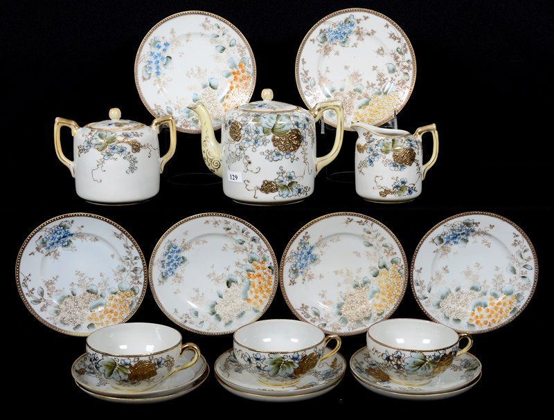 (18) PIECE MARKED NIPPON TEA SERVICE: (18) PIECE MARKED NIPPON TEA SERVICE WHITE WITH BLUE FLORAL AND GOLD STENCIL HIGHLIGHTS - FEATURES TEAPOT, CREAMER, SUGAR, (3) CUPS, (6) SAUCERS, (6) 6.25" LUNCHEON PLATES