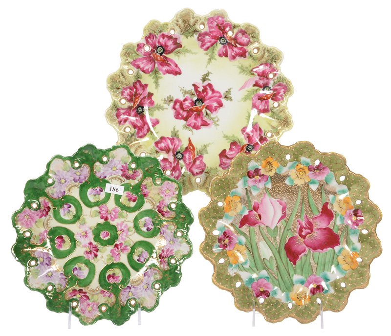 (3) UNMARKED NIPPON SCALLOPED PLATES: (3) UNMARKED NIPPON SCALLOPED PLATES WITH PIERCED BORDERS - (1) 11" YELLOW WITH LARGE PINK BLOSSOM DECOR - (1) 10.25" GREEN WITH IRIS GOLD DECOR AND GOLD TAPESTRY BACKGROUND - (1) 10" GREEN WITH LAVEN