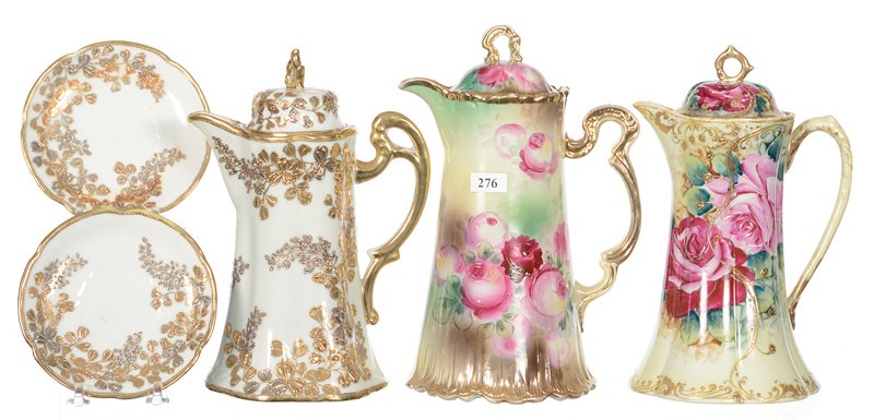 (3) NIPPON AND NIPPON STYLE CHOCOLATE POTS: (3) NIPPON AND NIPPON STYLE CHOCOLATE POTS INCLUDING - (1) 10" GREEN TONES WITH ROSE DECOR, GOLD TRIM HIGHLIGHTS - (1) 9.5" GREEN AND YELLOW TONES WITH PINK ROSE DECOR - (1) 9.25" WHITE WITH SILVER AN