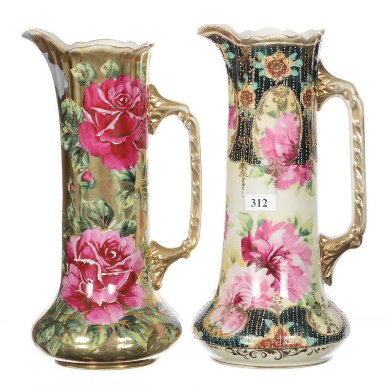 (2) 10.5" UNMARKED NIPPON TANKARDS: (2) 10.5" UNMARKED NIPPON TANKARDS - (1) WHITE AND DARK GREEN, PINK FLORAL WITH TAPESTRY HIGHLIGHTS - (1) GOLD BACKGROUND WITH PINK ROSE DECOR