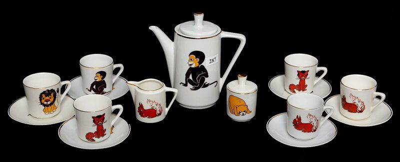 FIFTEEN PIECE CHILD'S TEA SET: FIFTEEN PIECE CHILD'S TEA SET UNMARKED GERMANY - 5.75" TEA POT WITH CREAMER, SUGAR, (6) CUPS AND SAUCERS - WHITE WITH MONKEY, SQUIRREL AND BEAR DECOR