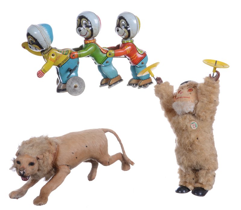 (3) TOYS INCLUDING: (3) TOYS INCLUDING (1) 8" WIND-UP FUZZY MONKEY SPINNING PLATES - (1) 9" TIN WIND-UP, THREE ICE SKATERS - (1) 9" "FUR" COVERED LION, WIRE FRAME, NICE DETAIL