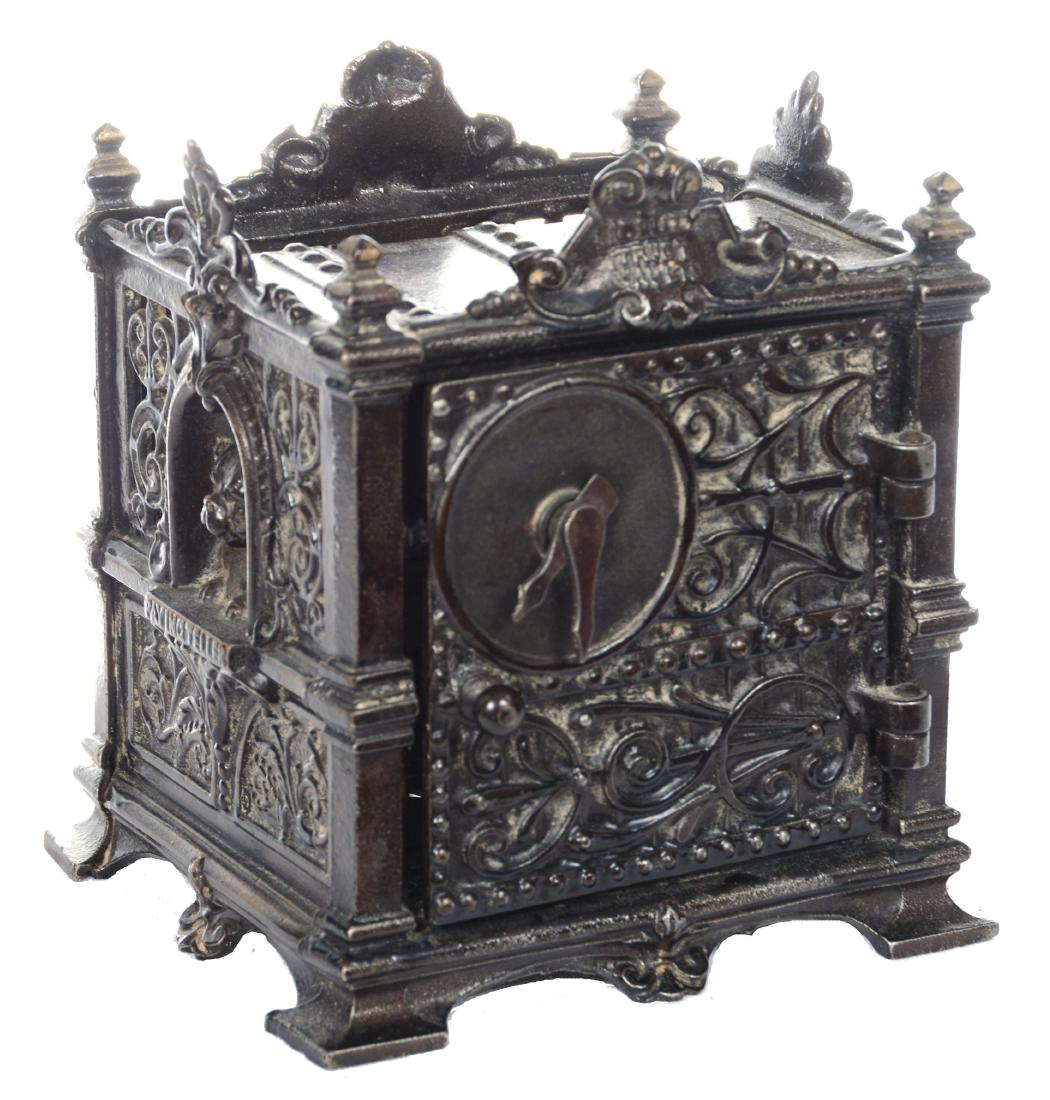 6.5" X 5.5" CAST IRON "FIDELITY TRUST BANK": FEATURES A LETTER BOX HOLDER - COMBINATION LOCK MECHANISM WHICH IS LOOSE - 