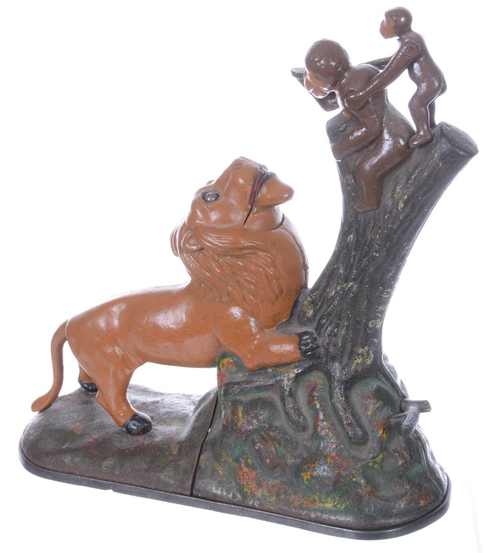 9.5" X 9.5" CAST IRON MECHANICAL BANK - LION AND TWO: MADE BY KYSER AND REX - PATENT DATE 1883 - LION AND MONKEYS HAVE BEEN REPAINTED - GOOD WORKING CONDITION 