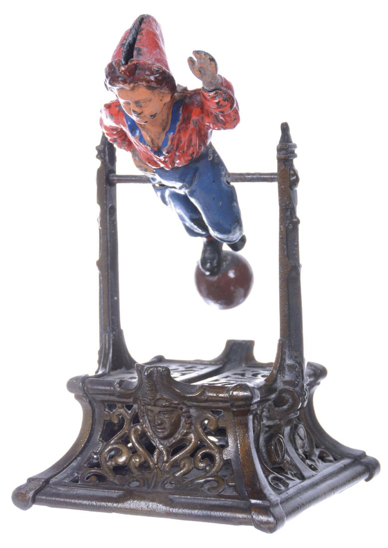 9.5" CAST IRON MECHANICAL BANK - BOY ON TRAPEZE: DATED 1888 - PRODUCED BY J. BARTON SMITH COMPANY 
