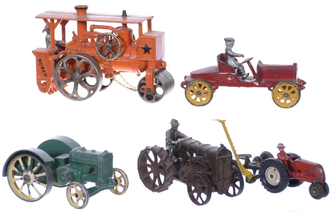 (6) CAST IRON VEHICLES AND IMPLEMENTS INCLUDING: (1) 5.25" X 7.25" HUBLEY "HUBER" TOY STEAM ROLLER WITH VERY GOOD PAINT - (1) 4" X 7.25" AUTOMOBILE, RED WITH YELLOW WHEELS - (1) 3" X 6" JOHN DEERE TRACTOR WITH IRON WHEELS - (1) 4" X 5.5" TRACTO