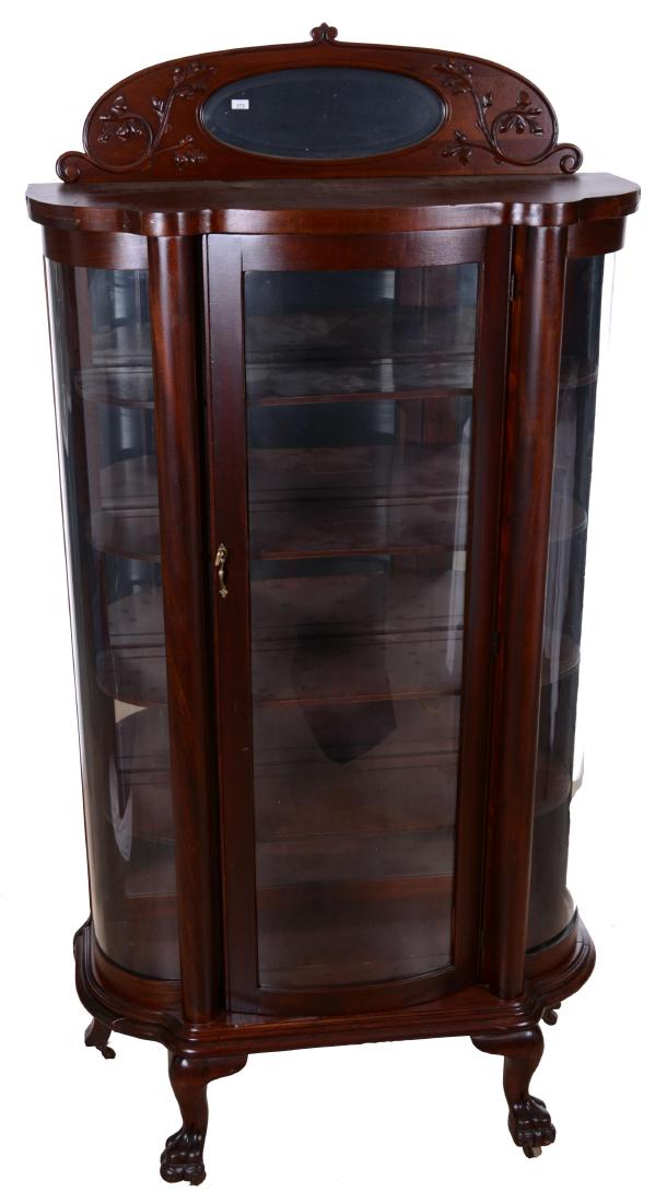 77" X 40" MAHOGANY BOW FRONT CHINA CABINET: ONE DOOR - MIRROR BACK - FOUR SHELVES - BEVELED MIRROR FRAMED WITH LEAF DESIGN TOP PIECE - SOME LIGHT VENEER CRACKING ON ONE EDGE 