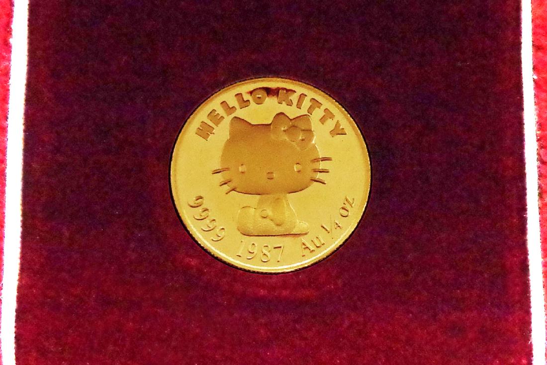 Hello Kitty .9999 gold: Lot # 164A Hello Kitty .9999 gold Japan 1987 Hello Kitty .9999 fine gold Proof 1/4 ounce medallion, with engraved number 0603, with original case. No sales tax. Estimate: $500 - 700