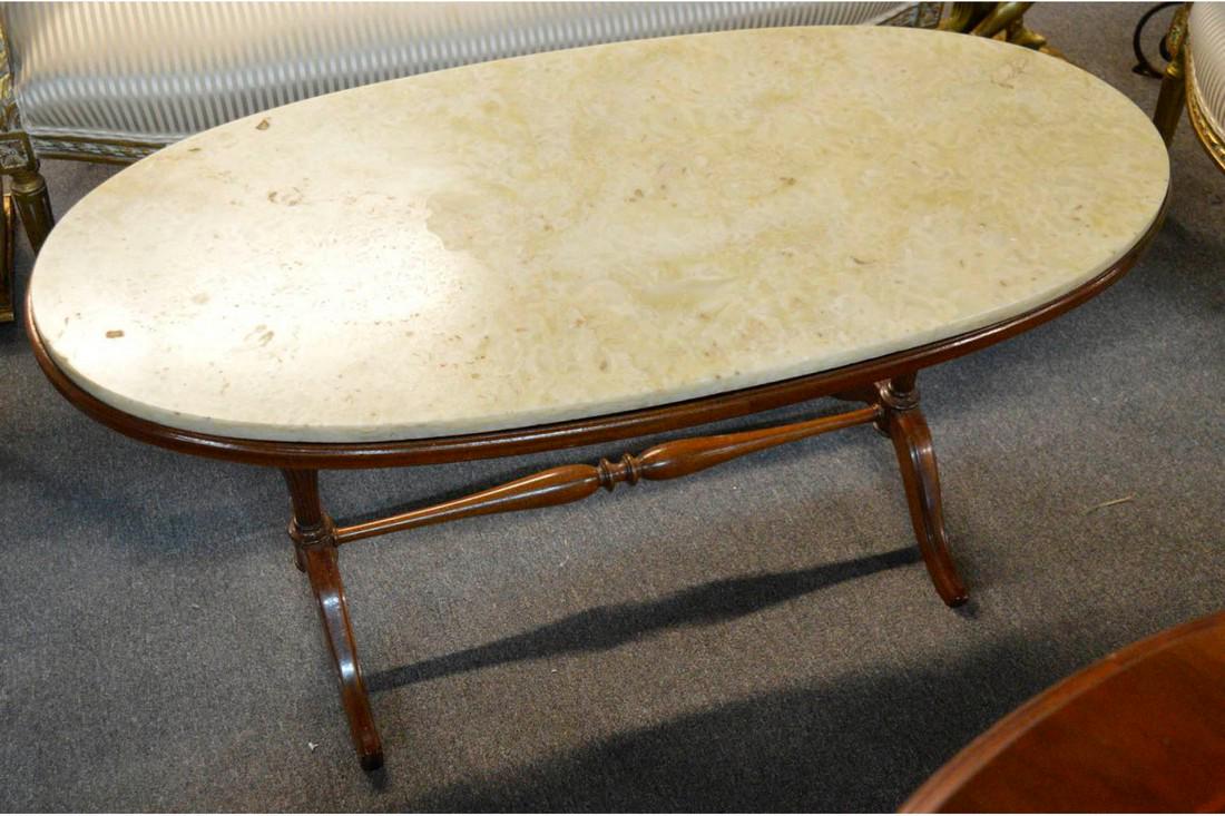 Italian Cocktail Table: Antique Italian cocktail table with marble top with Duncan Phyfe-style legs and stretcher base. Height: 53cm (21"). Width: 109cm (43").