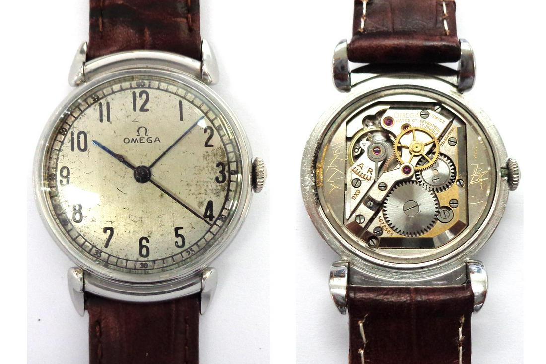 Vintage Omega: Gent's vintage steel Omega manual wind wristwatch fancy semi-hooded lugs on a brown leather bracelet.