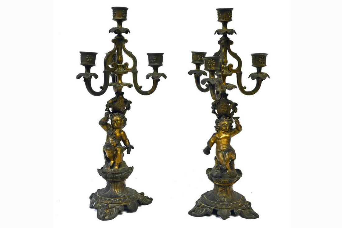 Pair of Antique Candelabras: Pair of Italian antique bronze candelabras with cherubs supports. Height: 38cm (15").