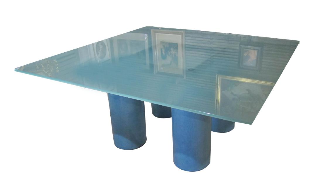 Square salon table: Serenissimo (It.): Superb modern Italian-designed square dining table, fitted pale blue glass top and blue cylindrical legs. Designers: David Law, Lella Vignelli, and Massimo Vignelli. Signed. Top: 63