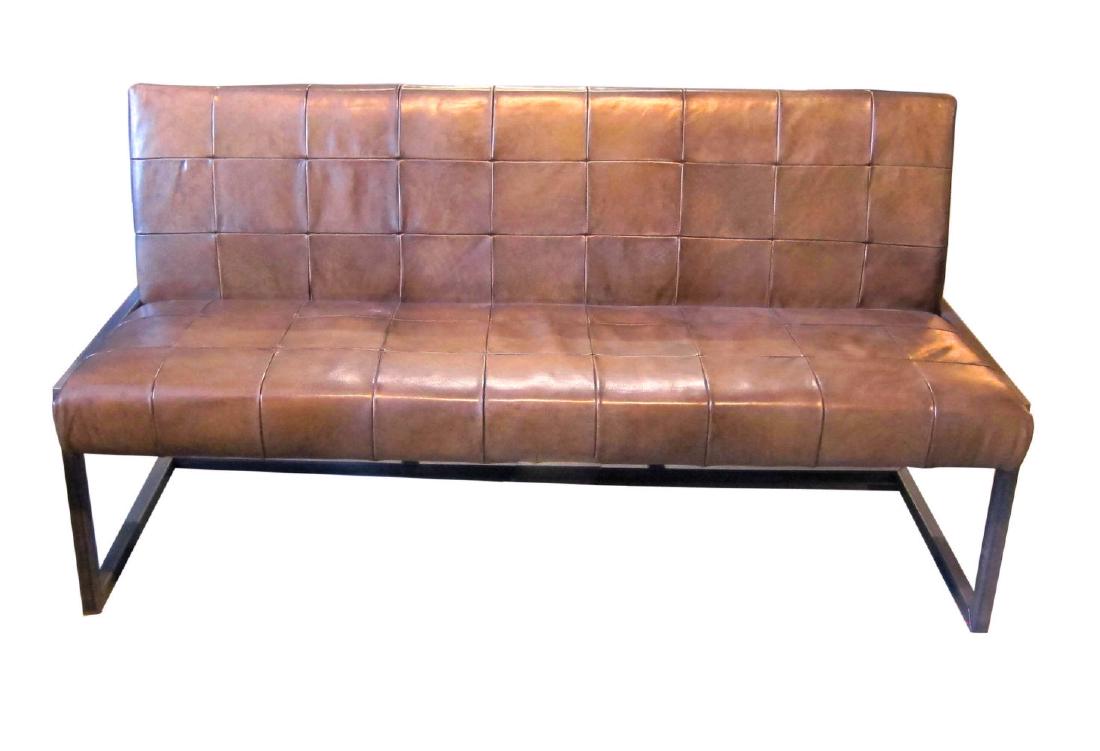 Modern-style European sofa: Modern-style European sofa, with chrome base; the rectangular back and seat upholstered with hand-stitched taupe leather. Length: 64". Width: 27". Height: 33".