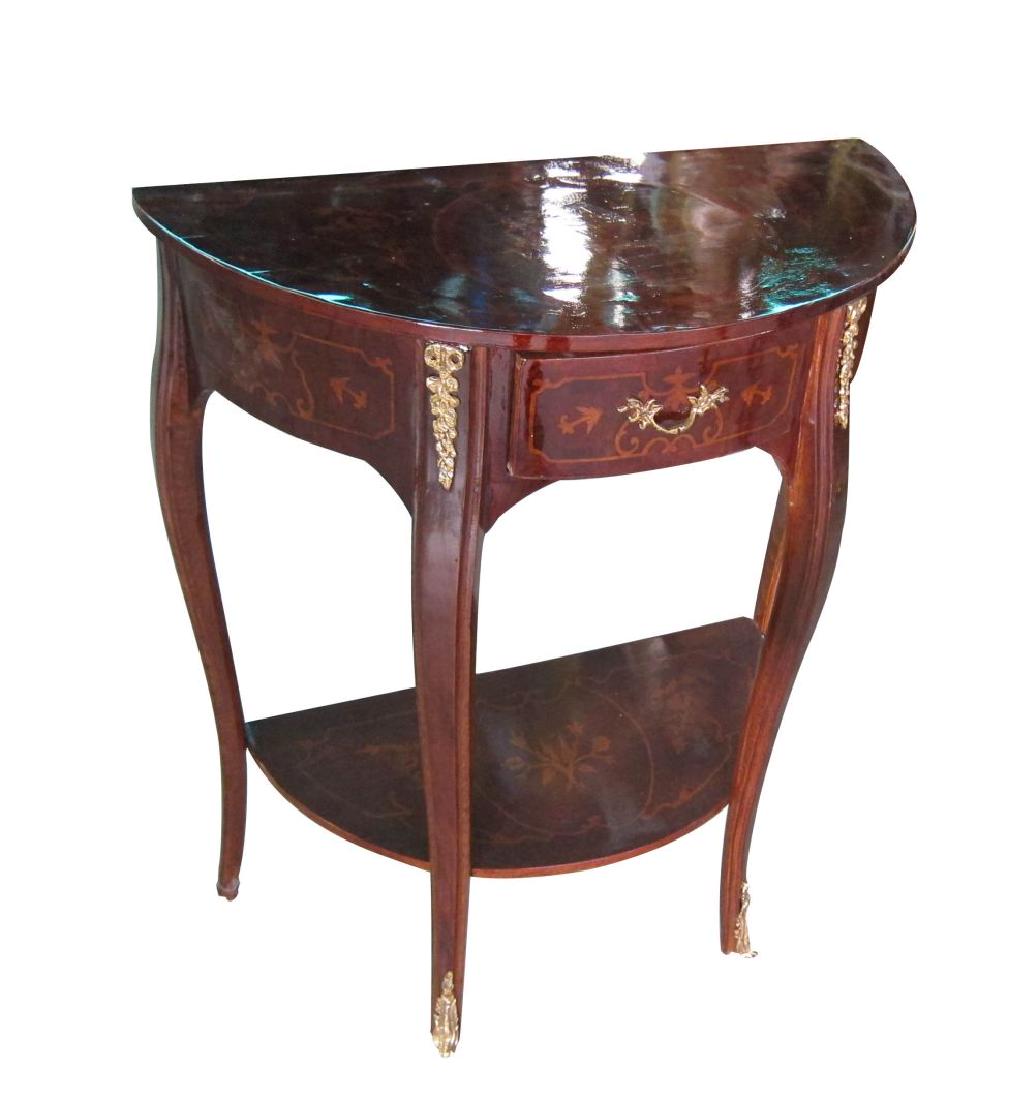 Pair of Louis XV-style demi-lune consoles: Pair of Louis XV-style demi-lune consoles, decorated overall with floral marquetry and ormolu mounts; fitted with a drawer over a lower. Height: 29". Width: 24". Depth: 12".