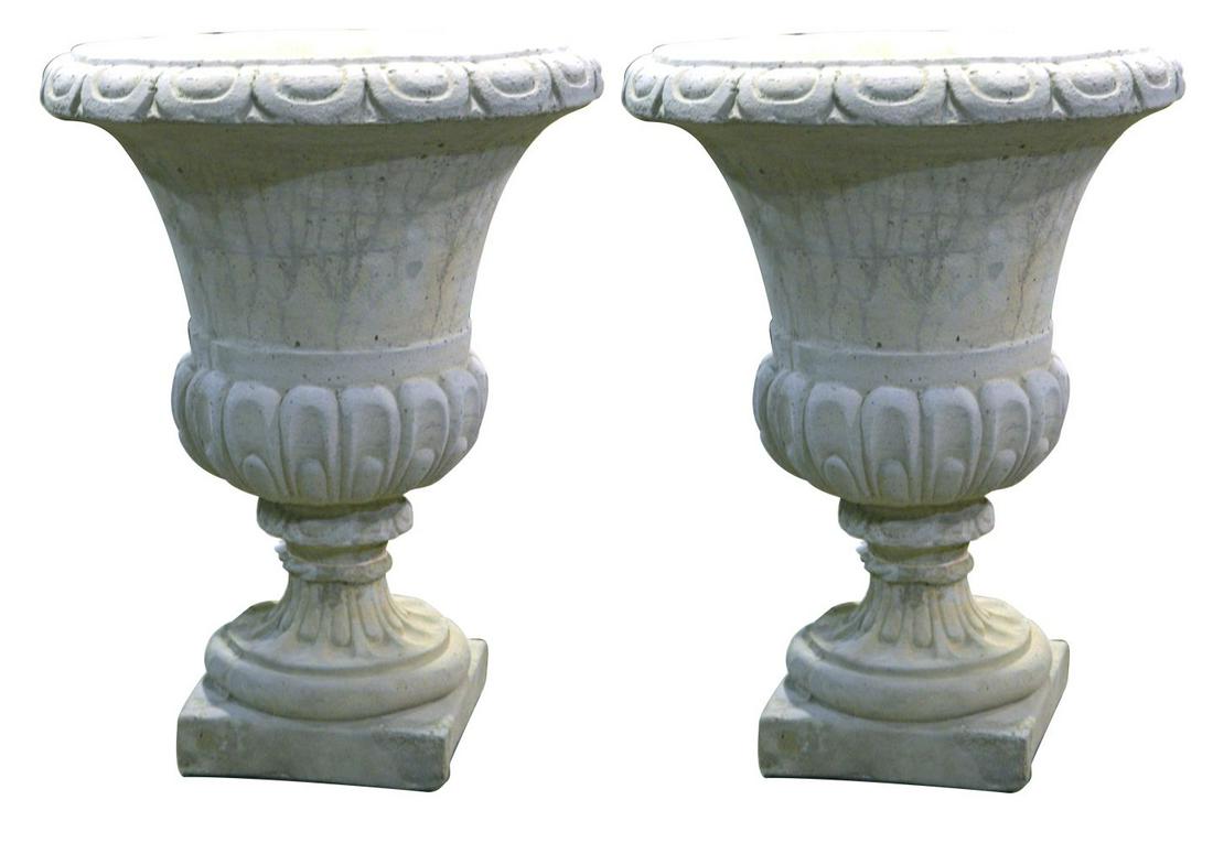 Pair of neoclassical-style stone garden urns: Pair of European neoclassical-style hand-polished quartz stone garden urns, the waisted body and scalloped rim on a square foot. 24" tall.