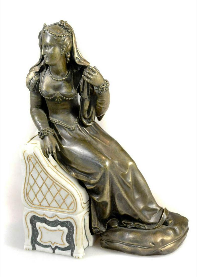 Bronze sculpture: Bronze sculpture of a young woman sitting on a marble bench. Provenance: France. Circa 1950. 9" tall.