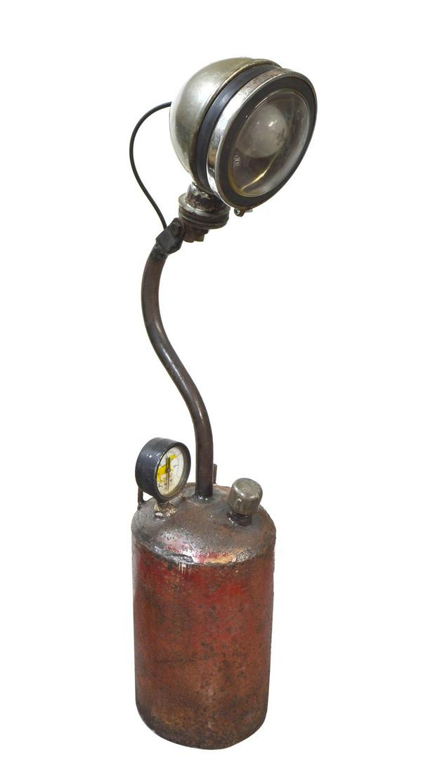 Industrial style table lamp: Vintage industrial style table lamp, fashioned from mechanical items, including a pressure gauge and oil can. Height: approx. 31.5".