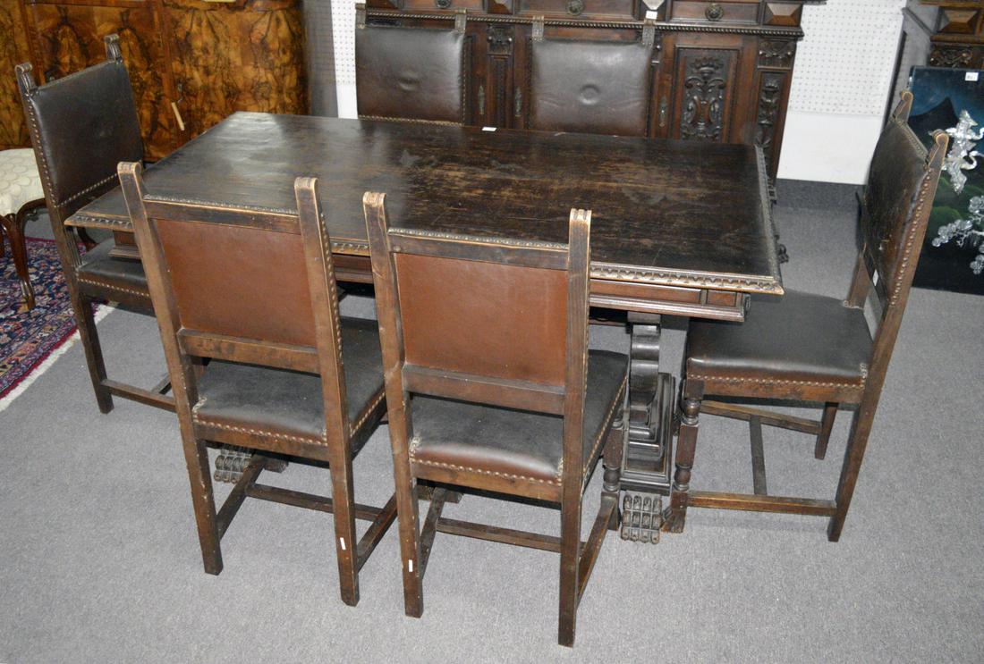 Antique Louis XIV-style oak dining table: Antique Louis XIV-style hand-carved oak dining table and 6 oak chairs with brown leather backs and seats. Table: 61" long, 34" wide, 31" tall. Chairs: 40" tall, 18" long, 18" wide.
