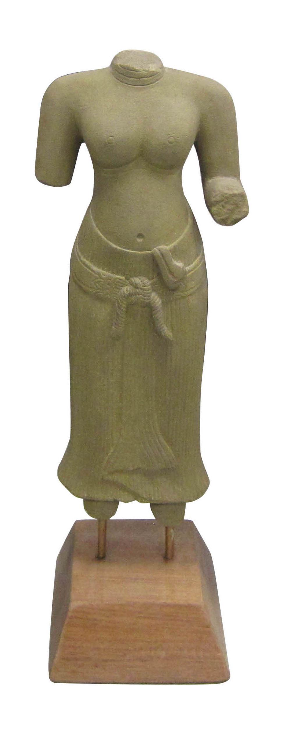 Quartz stone carving of female figure: Nepalese quartz stone carving, depicting a female torso. Resting on a wood base. 23" tall.
