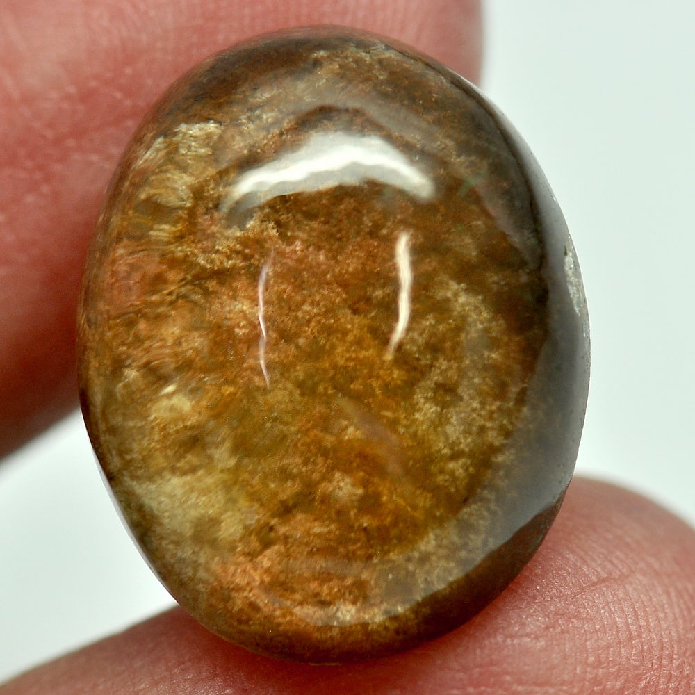 Moss Brown White Quartz 21.07 Ct. Oval Cab 20.5 x 16.4 Mm. Natural Gem Unheated: Gemstone Natural Natural Quartz ProductID 805529335 Weight 21.07 CT. Size 20.5 x 16.4 x 9.1 Mm. Shape Oval Cabochon Color White Clarity Semi - Transparent Luster Good Origin Thailand Treatment Unheate