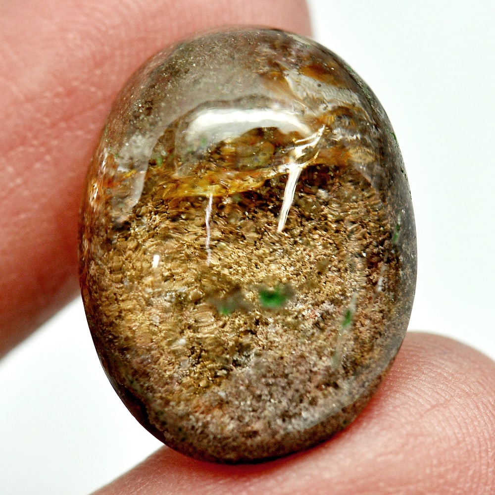 Moss Brown White Quartz 21.52 Ct. Oval Cabochon 22 x 16 x 9.3 Mm. Natural Gem: Gemstone Natural Natural Quartz ProductID 805529338 Weight 21.52 CT. Size 22 x 16 x 9.3 Mm. Shape Oval Cabochon Color White Clarity Semi - Transparent Luster Good Origin Thailand Treatment Unheated Ha