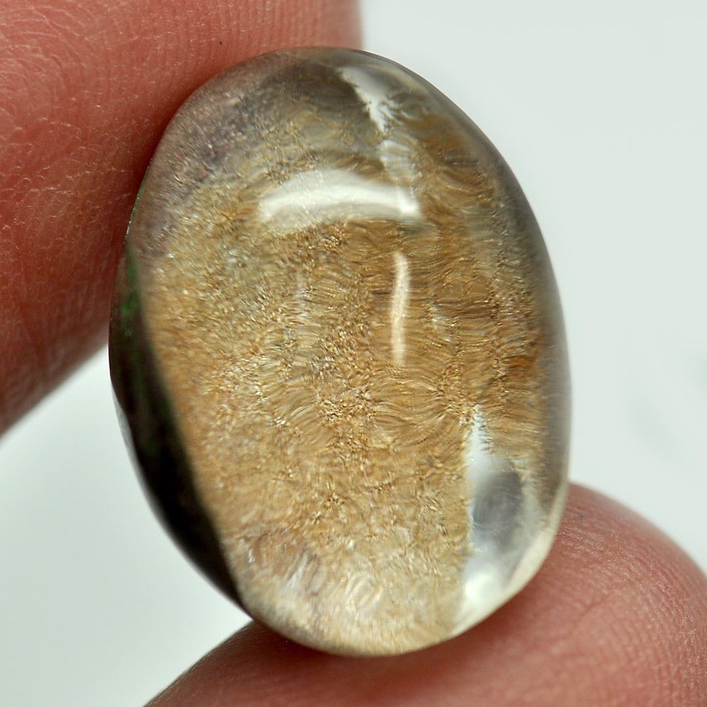 Moss Brown White Quartz 20.14 Ct. Oval Cabochon 20 x 15 x 9 Mm. Natural Gem: Gemstone Natural Natural Quartz ProductID 805529346 Weight 20.14 CT. Size 20 x 15 x 9 Mm. Shape Oval Cabochon Color White Clarity Semi - Transparent Luster Good Origin Thailand Treatment Unheated Hard
