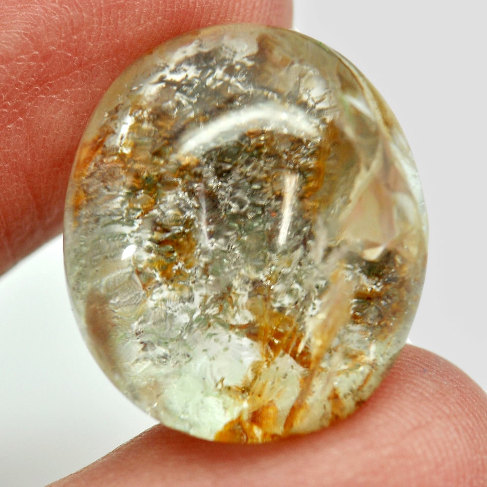 Moss Brown White Quartz 24.77 Ct. Oval Cabochon Natural Gemstone Unheated: Gemstone Natural Natural Quartz ProductID 805529401 Weight 24.77 CT. Size 20 x 17.1 x 11.3 Mm. Shape Oval Cabochon Color White Clarity Semi - Transparent Luster Good Origin Thailand Treatment Unheated