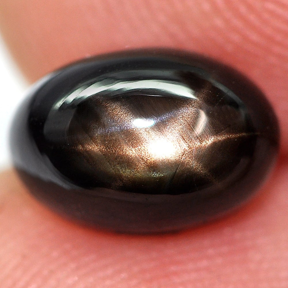 Black Star Sapphire 6 Rays 2.61 Ct. Oval Cabochon Shape 8.3 x 5.7 Mm. Natural Gemstone From Thailand: Product ID: 806161603 / Product Name: Natural Star Sapphire / Weight: 2.61 CT. / Size: 8.3 x 5.7 x 4.6 MM. / Shape: Oval Cabochon / Color: Black / Clarity:Opaque / Luster: Good 6 Rays Star / Gems Orig