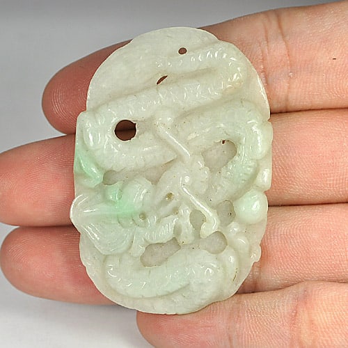White Green Jade 75.54 Ct. Dragon Carving with Drilled 51 x 35 Mm. Natural Gemstone: Product ID: 819809016 / Product Name: Natural Jade / Weight: 75.54 CT. / Size: 51 x 35 x 6 MM. / Shape: Dragon with Drilled / Color: Green / Clarity:Opaque / Luster: Good / Gems Origin: Thailand / Tre