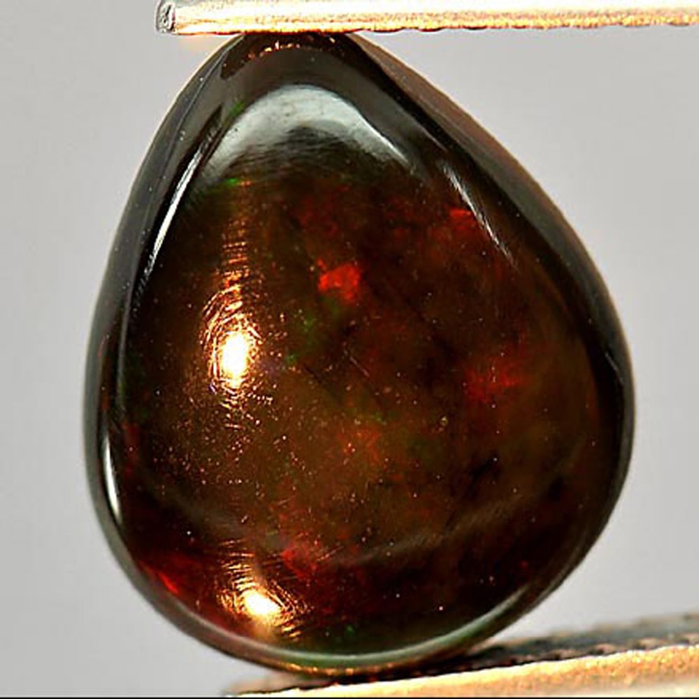 Fire Red Black Opal 2.56 Ct. Play Of Color Rainbow Pear Cabochon Shape 2.8 x 10.6 Mm. Natural (1 of 3)