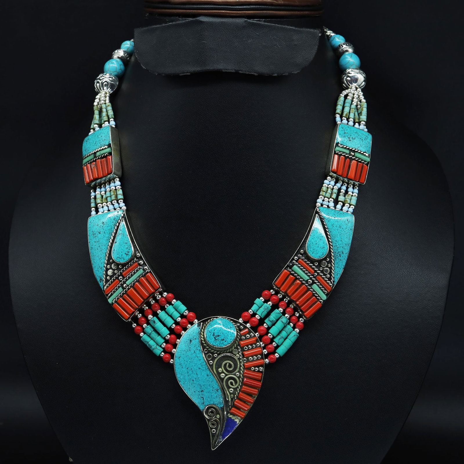 Tibetan Turquoise & Coral Handmade Bold Necklace: This is a very special design Turquoise & Coral Necklace. It is designed and made from Natural Turquoise & Coral beads, brass beads together with special design beads with Beautiful Pendant . This is 