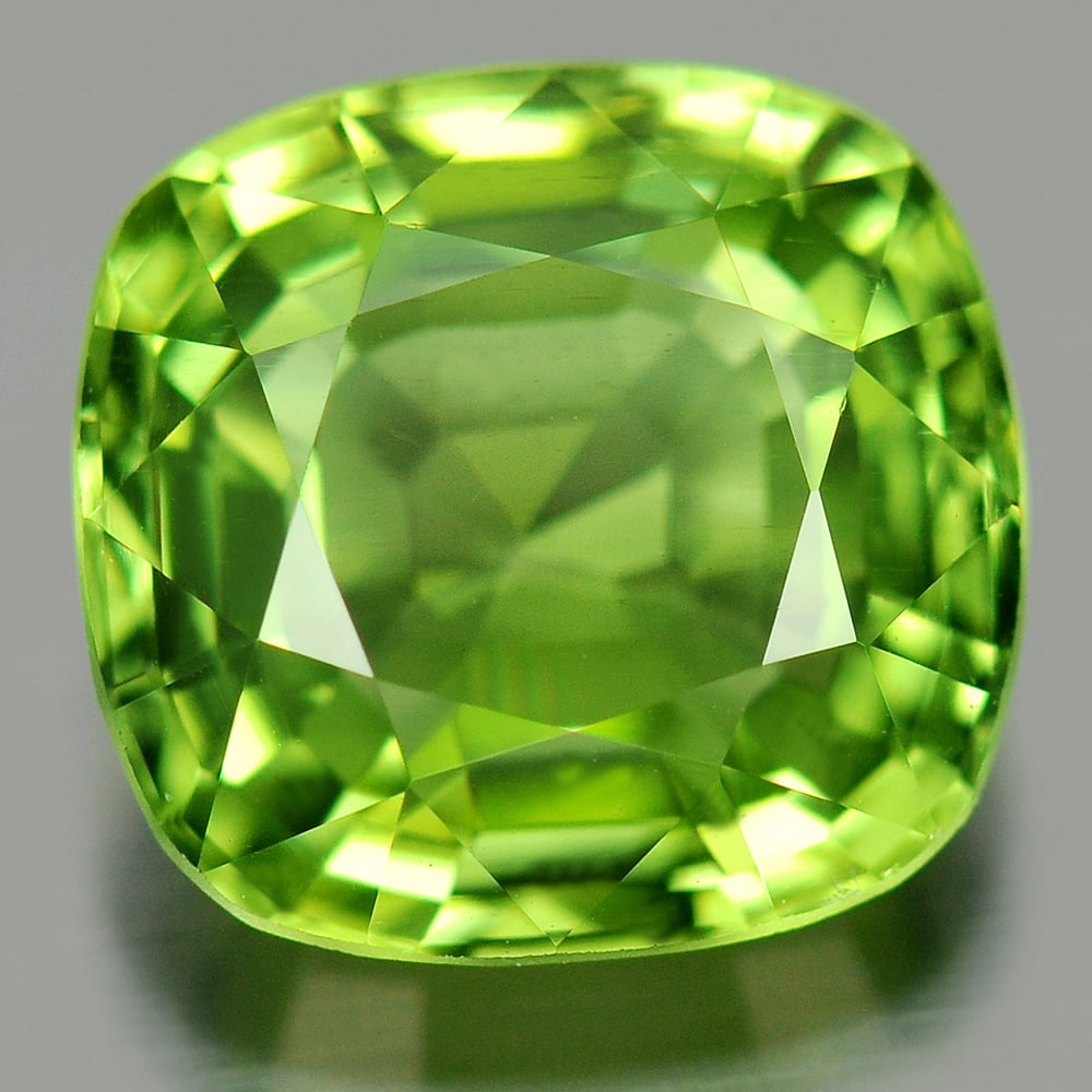Green Peridot 3.19 Ct. VVS Cushion Shape 9.1 x 8.6 Mm. Natural Gemstone Unheated: Product ID: 805313078 Product Name: Natural Peridot Weight: 3.19 CT. Size: 9.1 x 8.6 x 5 MM. Shape: Cushion Color: Green Clarity:VVS Luster: Very Good Gems Origin: Pakistan Treatment: Unheated Crystal