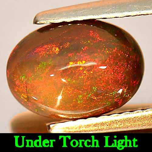 Play Of Color Rainbow Fire Red Black Opal 1.56 Ct. Oval Cabochon Shape 10 x 7.3 Mm. Natural Gemstone: Product ID: 818725734 Product Name: Natural Opal Weight: 1.56 CT. Size: 10 x 7.3 x 4.7 MM. Shape: Oval Cabochon Color: Multi-Color Clarity:Opaque Luster: Iridescent Gems Origin: Ethiopia Treatment: En