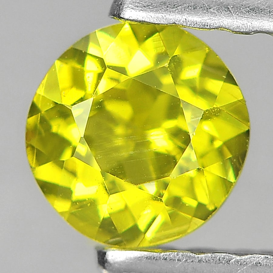 Greenish Yellow Mali Garnet 0.40 Ct. Round 4.5 Mm. Natural Unheated Gemstone From Madagascar: Product ID: 802936126 Product Name: Natural Mali Garnet Weight: 0.40 CT. Size: 4.5 x 2.8 MM. Shape: Round Color: Yellow Clarity:SI1 Luster: Very Good Gems Origin: Madagascar Treatment: Unheated Crysta