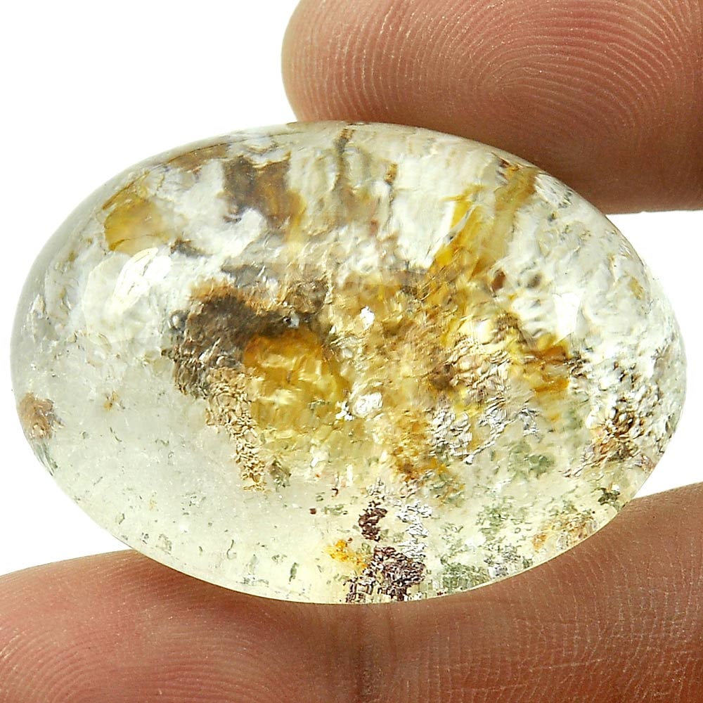 Moss Brown White Quartz 98.79 Ct. Oval Cabochon Shape 34 x 26 Mm. Natural Gemstone From Thailand: Product ID: 805529209 Product Name: Natural Quartz Weight: 98.79 CT. Size: 34 x 26 x 17.2 MM. Shape: Oval Cabochon Color: White Clarity:Semi - Transparent Luster: Good Gems Origin: Thailand Treatment:
