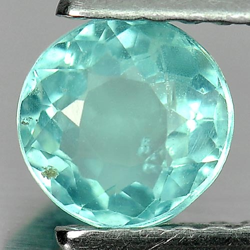 Paraiba Color Apatite 0.84 Ct. Round Shape 5.7 Mm. Natural Unheated Gemstone From Tanzania: Product ID: 800612626 Product Name: Natural Apatite Weight: 0.84 CT. Size: 5.7 x 5.7 x 3.5 MM. Shape: Round Color: Neon Blue Clarity:SI1 Luster: Good Gems Origin: Tanzania Treatment: Unheated Crystal 