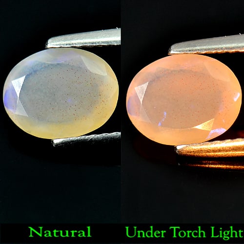 Multi-Color Play Of Colour Opal 0.87 Ct. Oval Shape 9 x 7 Mm. Natural Gemstone From Ethiopia: Product ID: 818719463 Product Name: Natural Opal Weight: 0.87 CT. Size: 9 x 7 x 4 MM. Shape: Oval Color: Multi Color Clarity:Semi - Transparent Luster: Good Gems Origin: Ethiopia Treatment: Unheated C