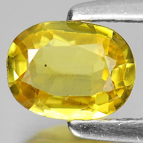 Yellow Sapphire 0.58 Ct. Oval Shape 6 x 4.6 Mm. Natural Gemstone From Thailand: Product ID: 806160983 Product Name: Natural Yellow Sapphire Weight: 0.58 CT. Size: 6 x 4.6 x 2.2 MM. Shape: Oval Color: Yellow Clarity:VSI Luster: Good Gems Origin: Thailand Treatment: Heated Crystal 
