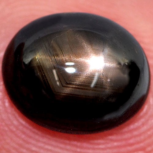 Black Star 6 Rays Sapphire 3.57 Ct. Oval Cabochon Shape 9.6 x 7.9 Mm. Natural Gemstone From: Product ID: 806136030 Product Name: Natural Star Sapphire Weight: 3.57 CT. Size: 9.6 x 7.9 x 4.2 MM. Shape: Oval Cabochon Color: Black Clarity:Opaque Luster: Good 6 Rays Star Gems Origin: Thailand Tre