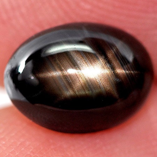 Natural Black Star Sapphire 6 Rays 3.07 Ct. Oval Cabochon Shape 9 x 6.7 Mm. Gemstone: Product ID: 806161648 Product Name: Natural Star Sapphire Weight: 3.07 CT. Size: 9 x 6.7 x 4.6 MM. Shape: Oval Cabochon Color: Black Clarity:Opaque Luster: Good 6 Rays Star Gems Origin: Thailand Treat