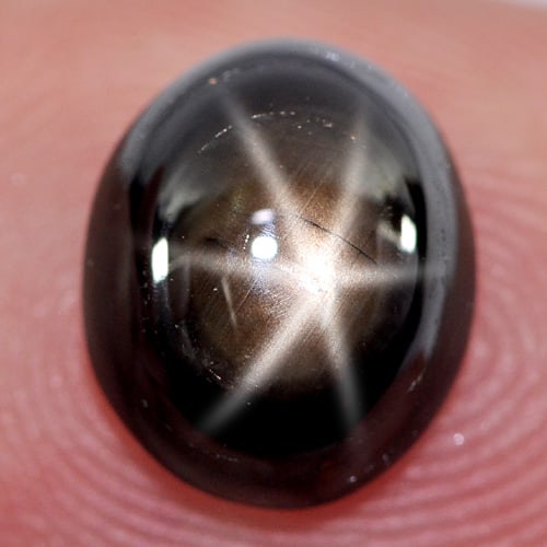 Natural Black Star Sapphire 6 Rays 3.24 Ct. Oval Cabochon Shape 9.2 x 7.6 x 4.4 Mm. Gemstone: Product ID: 806136638 Product Name: Natural Star Sapphire Weight: 3.24 CT. Size: 9.2 x 7.6 x 4.4 MM. Shape: Oval Cabochon Color: Black Clarity:Opaque Luster: Good 6 Rays Star Gems Origin: Thailand Tre