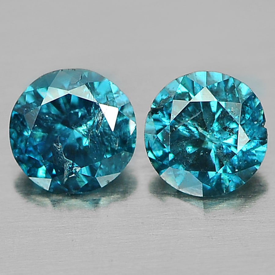 Natural Blue Loose Diamond 0.15 Ct. Round Brilliant Cut 2 Pcs. Size 2.7 Mm.: Product ID: 802103175 Product Name: Natural Enhanced Diamond Weight: 0.15 CT. Size: 2.7 x 2.7 x 1.6 MM. Shape: Round Brilliant Cut Color: Blue Clarity:VSI - SI1 Luster: Scintillating Gems Origin: Belg