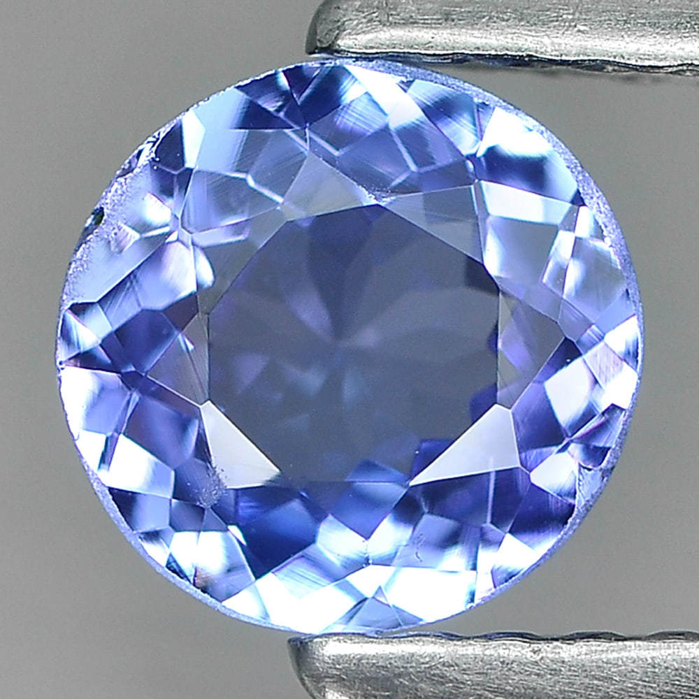 Violetish Blue Tanzanite 0.81 Ct. Round Shape 6 Mm. Natural Gemstone From Tanzania: Product ID: 807009574 Product Name: Natural Tanzanite Weight: 0.81 CT. Size: 6 x 6 x 3.2 MM. Shape: Round Color: Violetish Blue Clarity:SI Luster: Good Gems Origin: Tanzania Treatment: Heated Crystal 