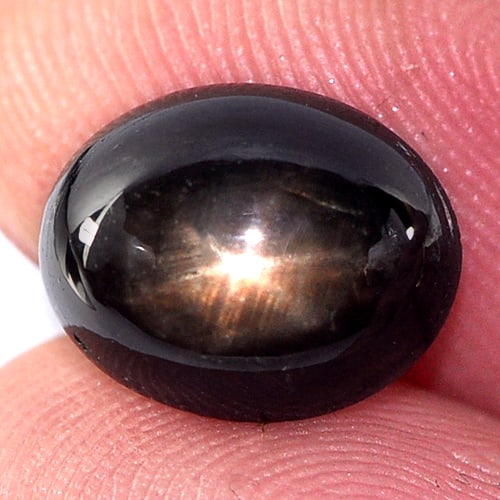 Black Star Sapphire 4.01 Ct. Oval Cabochon Shape 9.7 x 7.7 Mm. Natural Gemstone From Thailand: Product ID: 806134498 Product Name: Natural Star Sapphire Weight: 4.01 CT. Size: 9.7 x 7.7 x 5 MM. Shape: Oval Cabochon Color: Black Clarity:Opaque Luster: Good 6 Rays Star Gems Origin: Thailand Treat