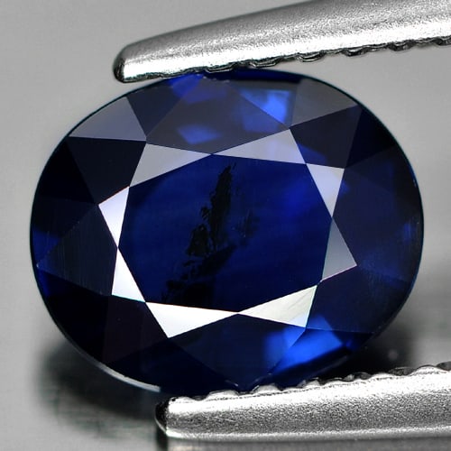 Certified Blue Sapphire 1.33 Ct. Oval Shape 7.38 x 6.12 Mm. Natural Gemstone From Thailand: Product ID: 806005602 Product Name: Natural Blue Sapphire Weight: 1.33 CT. Size: 7.38 x 6.12 x 3.19 MM. Shape: Oval Color: Blue Clarity:SI Luster: Good Gems Origin: Thailand Treatment: Heated Crystal 