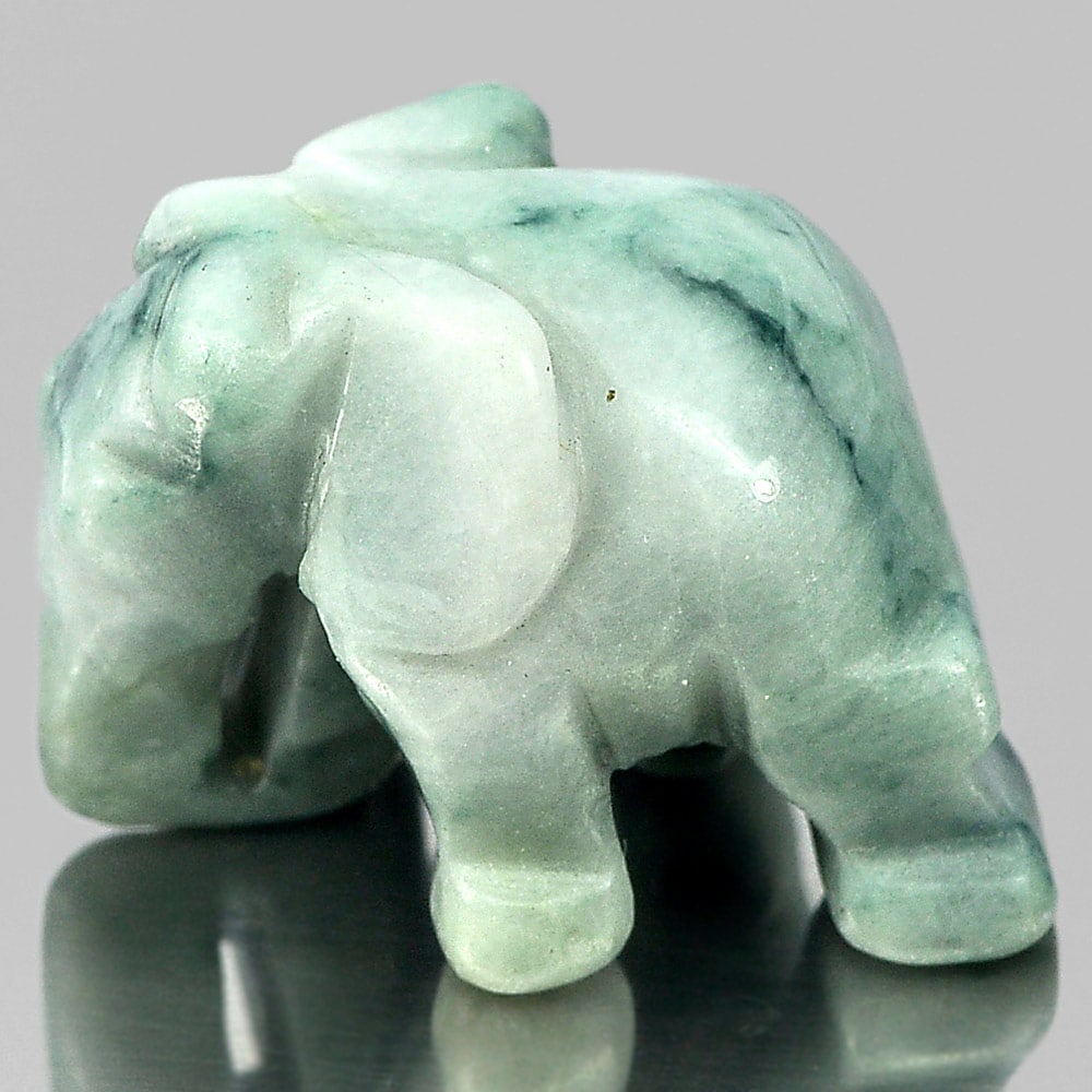 Green White Jade 56.56 Ct. Elephant Carving Shape 25 x 18 Mm. Gemstone From Thailand: Product ID: 819813064 Product Name: Natural Jade Weight: 56.56 CT. Size: 25 x 18 x 16 MM. Shape: Elephant Carving Color: Green Clarity:Opaque Luster: Good Gems Origin: Thailand Treatment: Unheated Cry