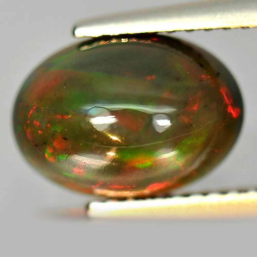 Play Of Color Rainbow Fire Red Black Opal 1.83 Ct. Oval Cabochon Shape 10.7 x 7.7 Mm. Natural (1 of 3)