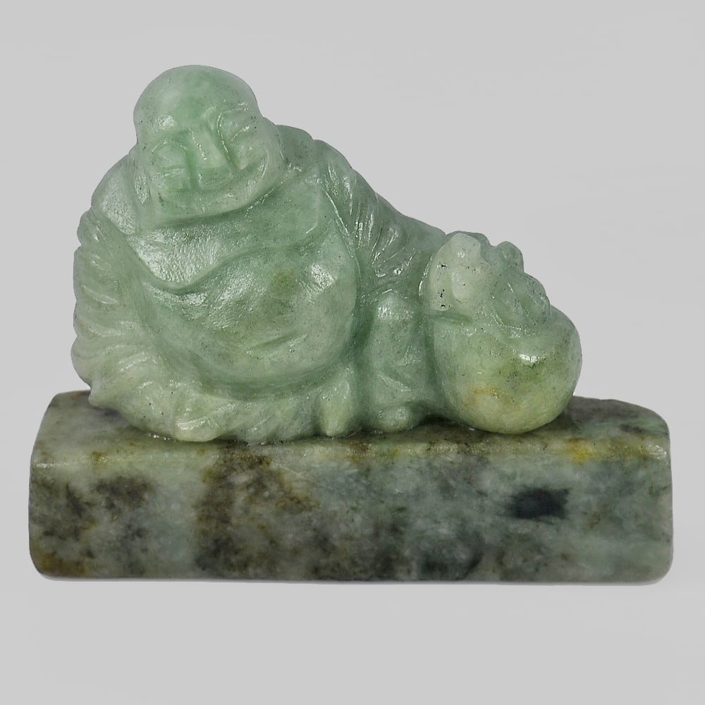 Green Color Jade 306.57 Ct. Happy Smile Buddha Carving Shape Natural Gemstone Unheated From Thailand: Product ID: 819814022 Product Name: Natural Jade Weight: 306.57 CT. Size: 58 x 50 x 13 MM. Shape: Buddha Carving Color: Green Clarity:Opaque Luster: Good Gems Origin: Thailand Treatment: Unheated Crys